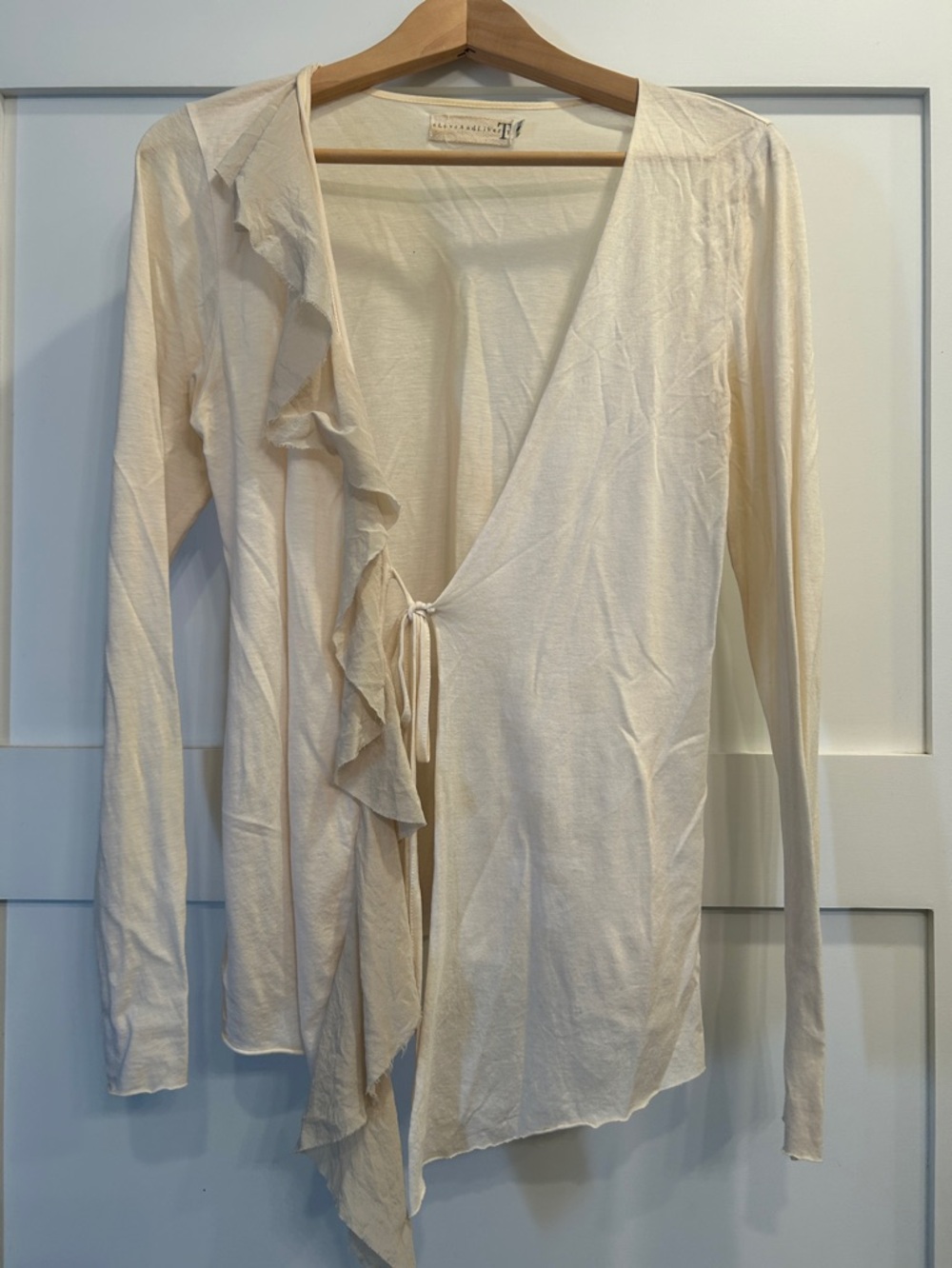 Light Cream Ruffle Wrap with simple tie closure.